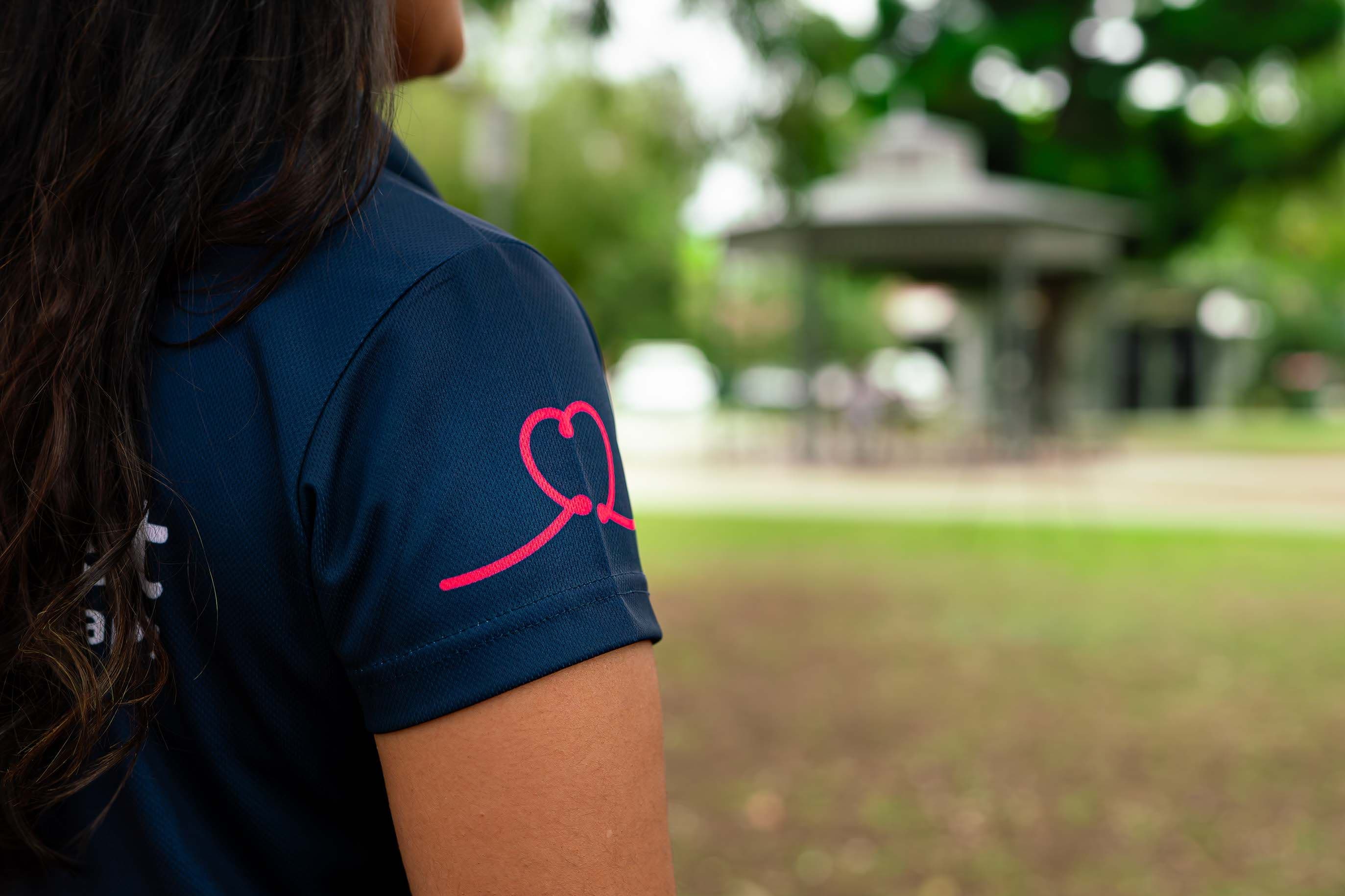 View from behind of a BlueRocket clinician with the heart scribble on the sleeve
