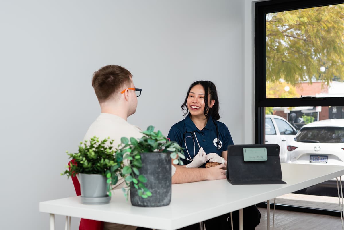 Clinician & client discussing their therapy