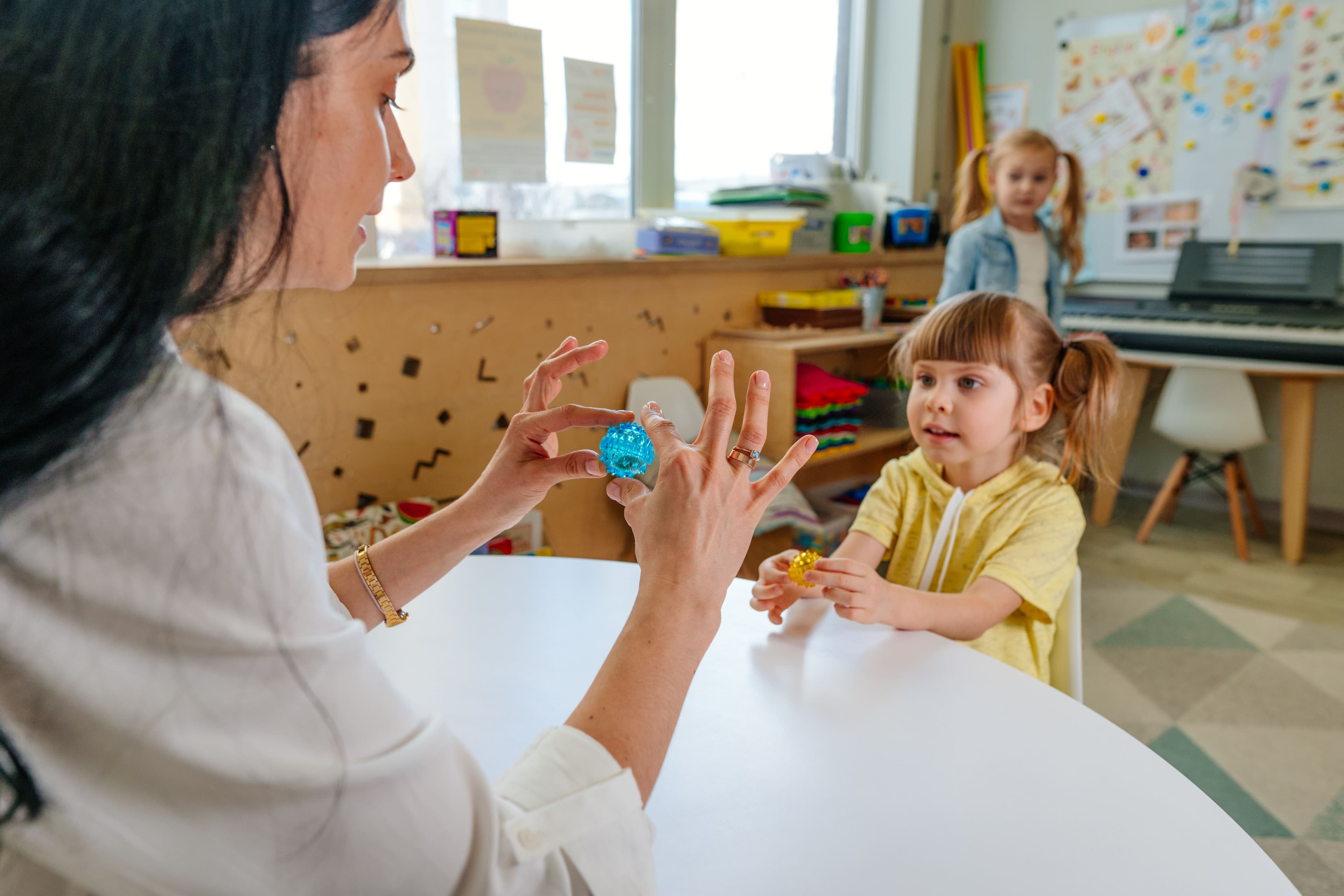 Adult and child in day care setting